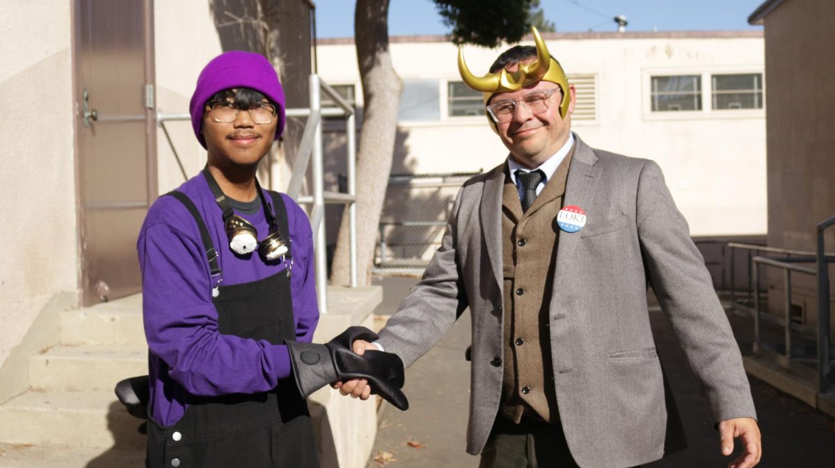 Shaking the hand of Mr. Puentes outside the old Auto shop building 