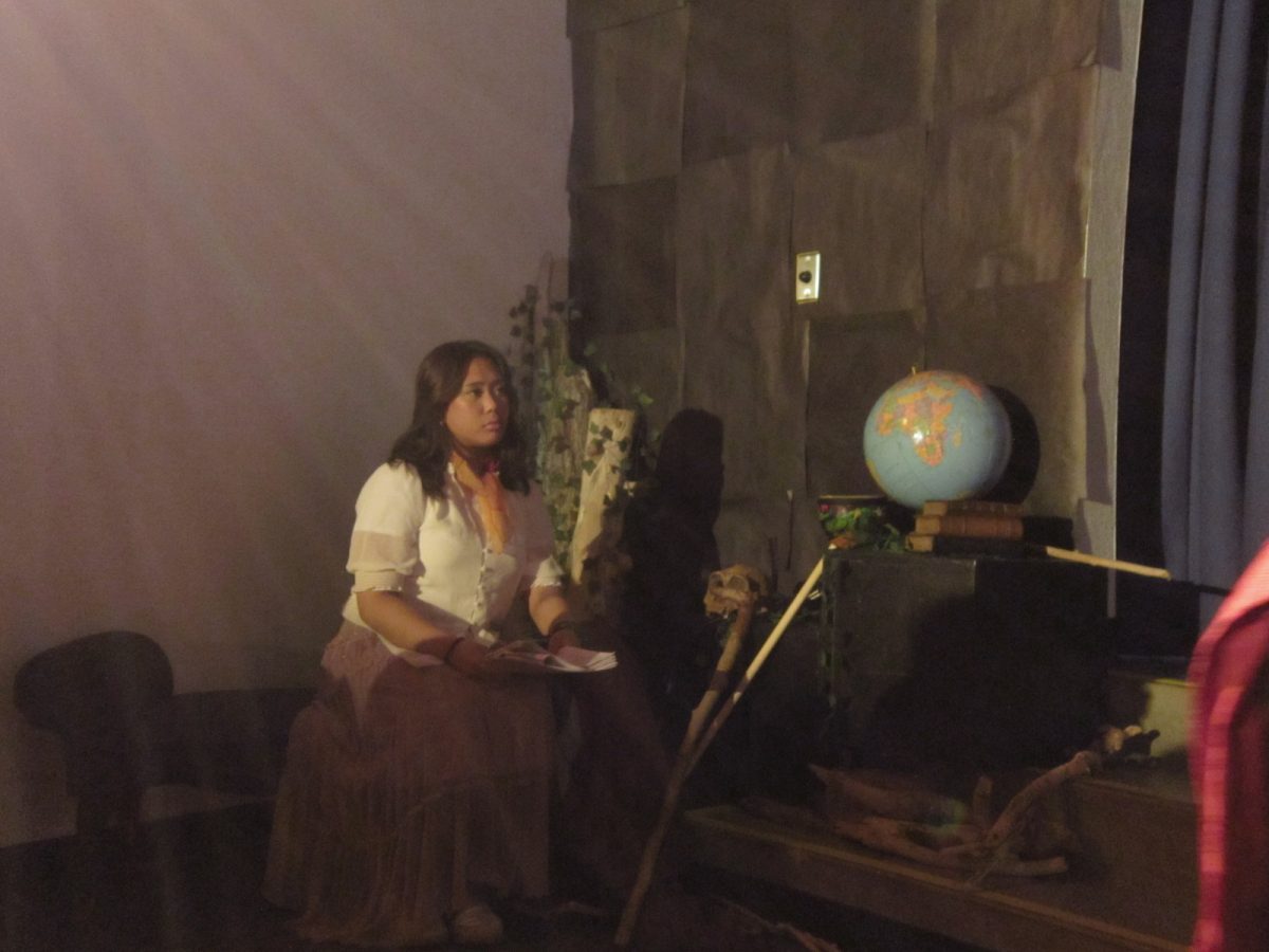 Ariel (played by Ianna Apura) sitting on the sidelines.