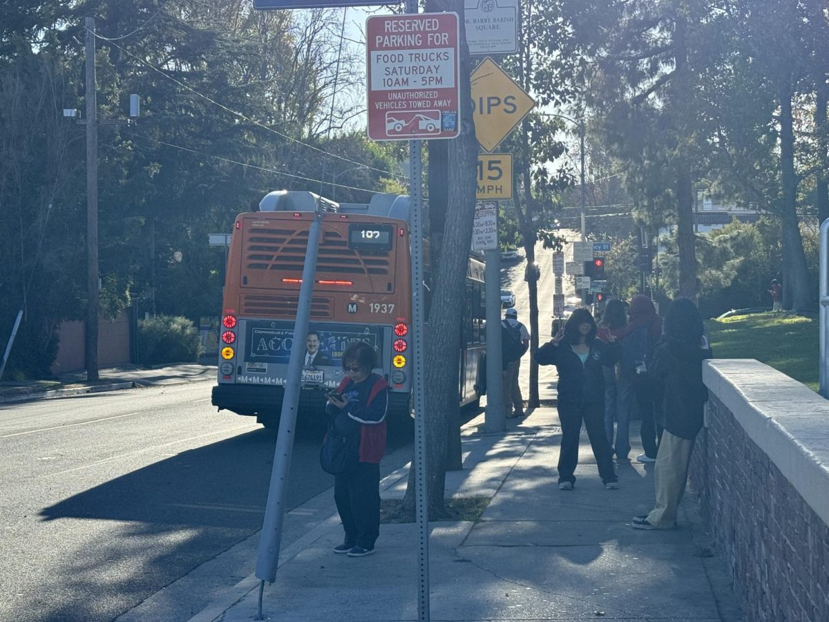 Passengers disembarking at the Saint George/Tracy bus stop.