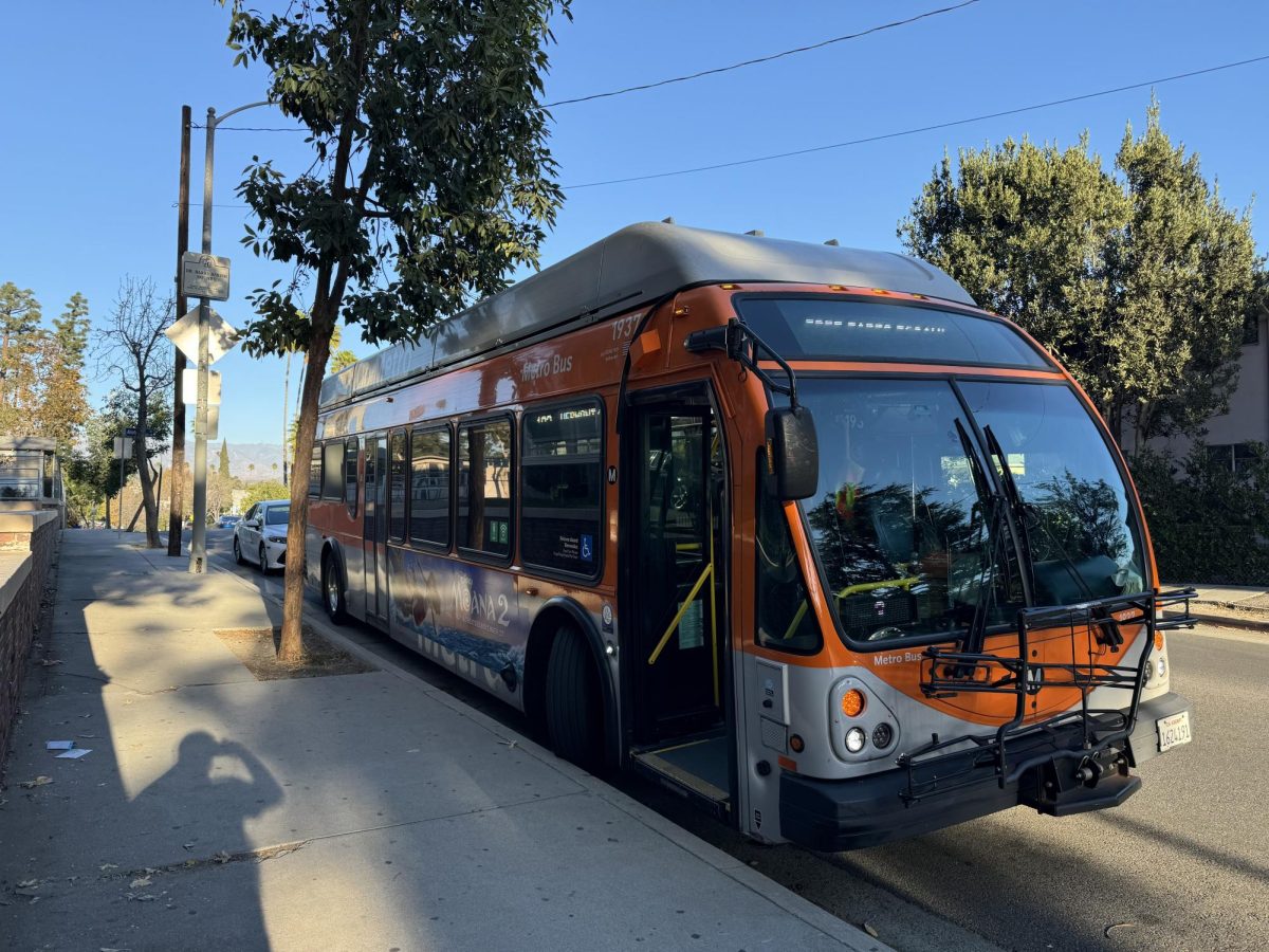 Supervisor and bus stopped at Saint George/Tracy bus stop.