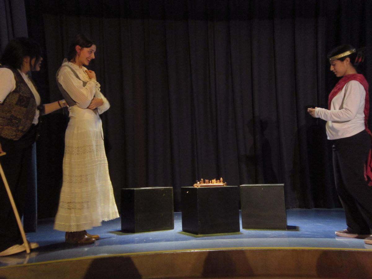 Prospero (played by Brianna Lopez Rodriguez) pictured left with Miranda (played by Magnolia Wallace) and Alonzo (played by Angelina Valencia) pictured right.