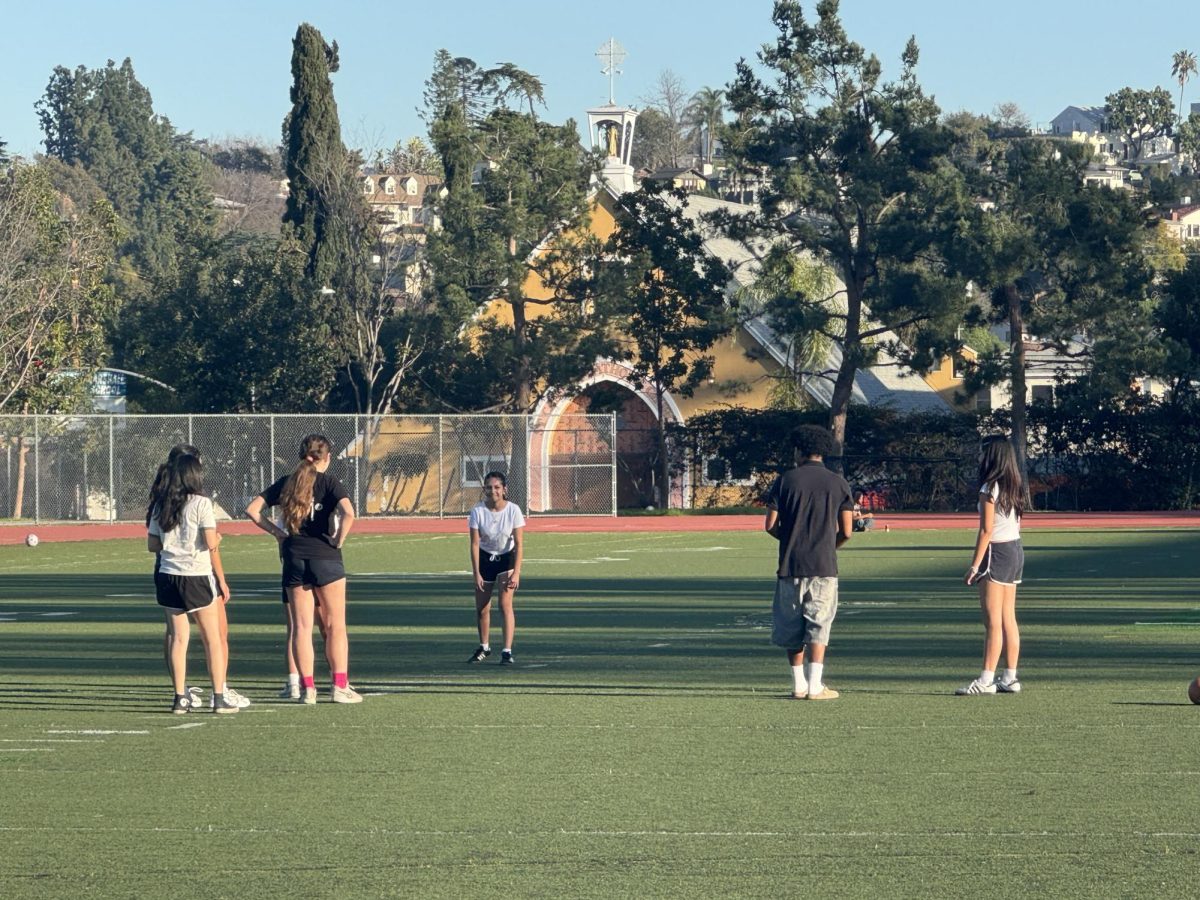 Powderpuff participants practice for the game.