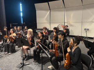 Marshall Orchestra receiving advice from Judge