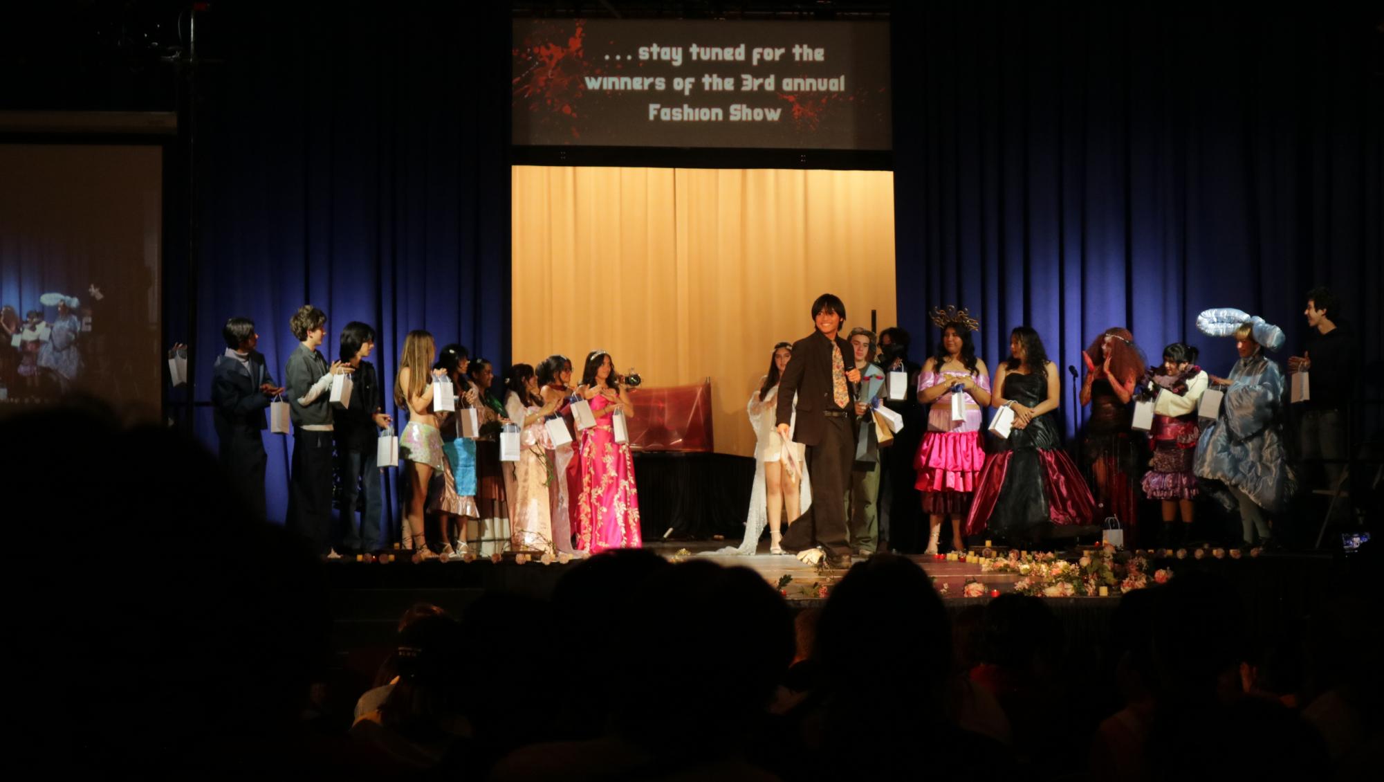 Nicholas Azagra (middle) announcing the 20 winners of this year's fashion show